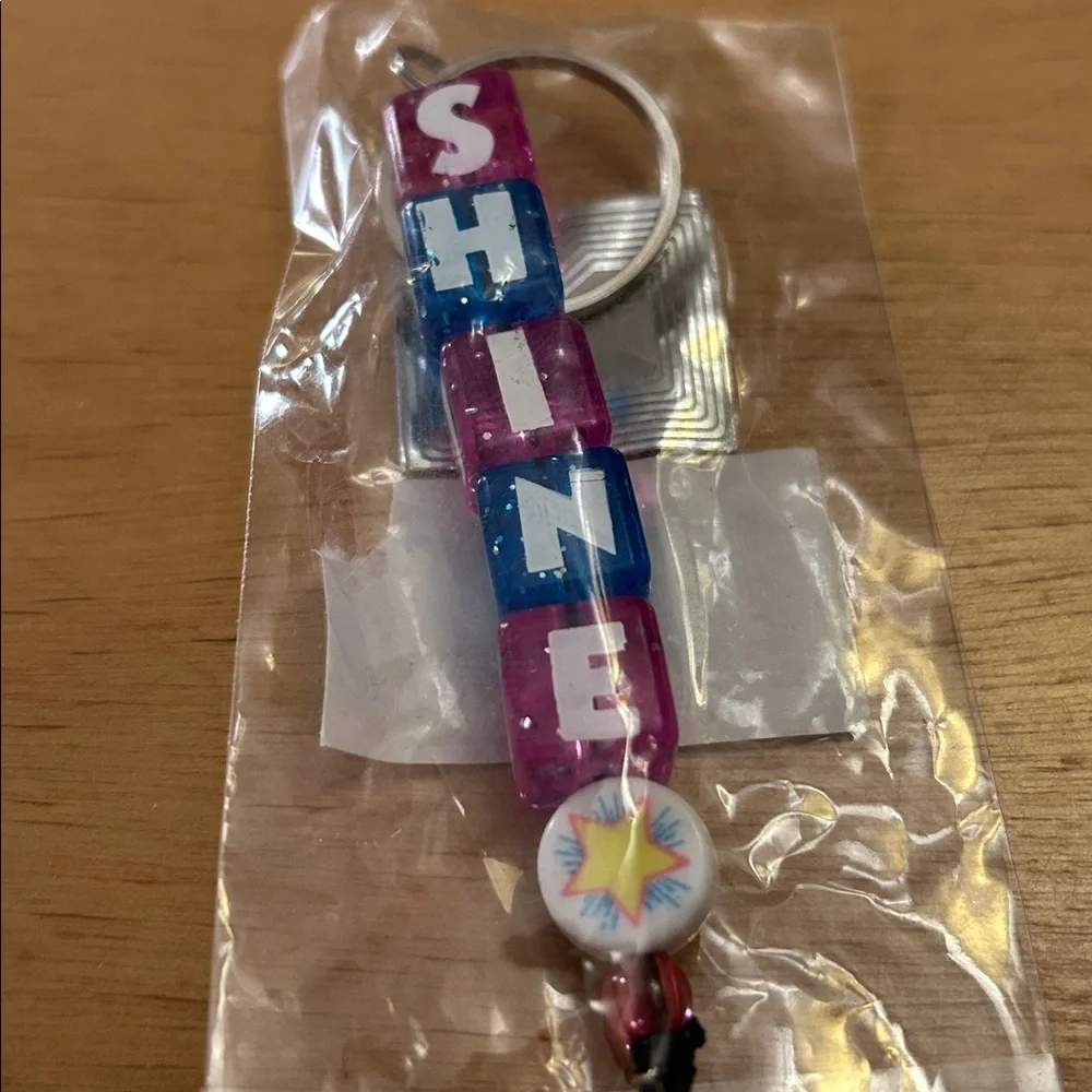 Free with bundle or purchase new Kids 🧒🏻 Shine Block Charm Keychain